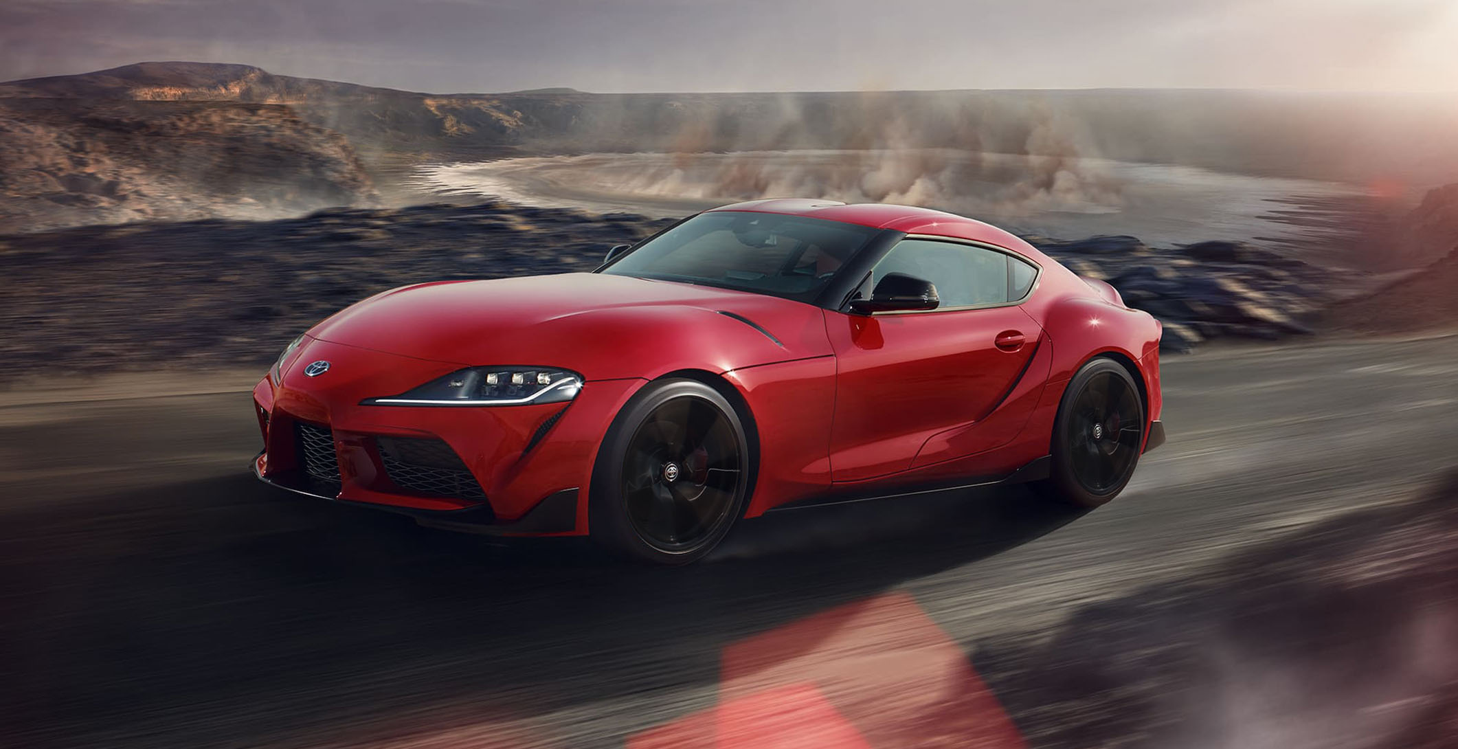 toyota supra prominence red 2020 front-view with older models